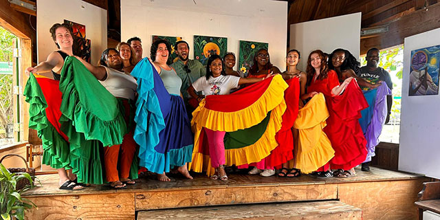 Students in colorful dresses.